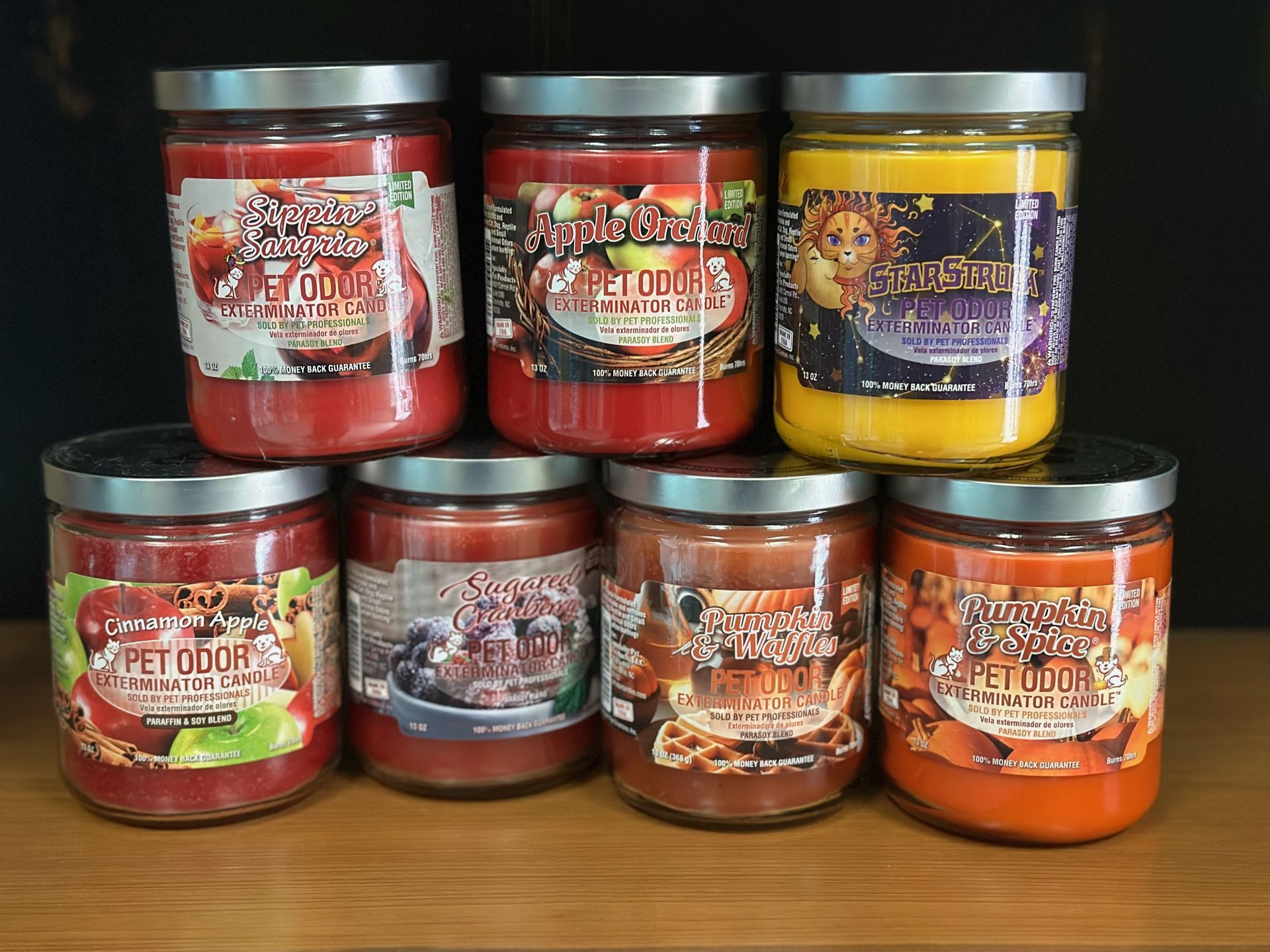 Several jars of candles are stacked on top of each other
