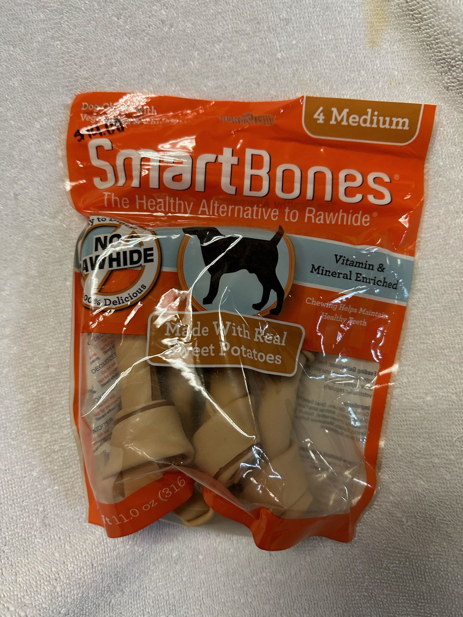 A bag of smart bones is sitting on a white cloth