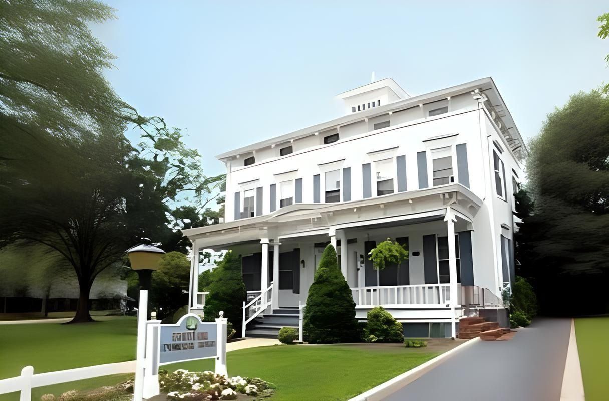 Peppler funeral home with gray shutters, porch, and a sign on the lawn.