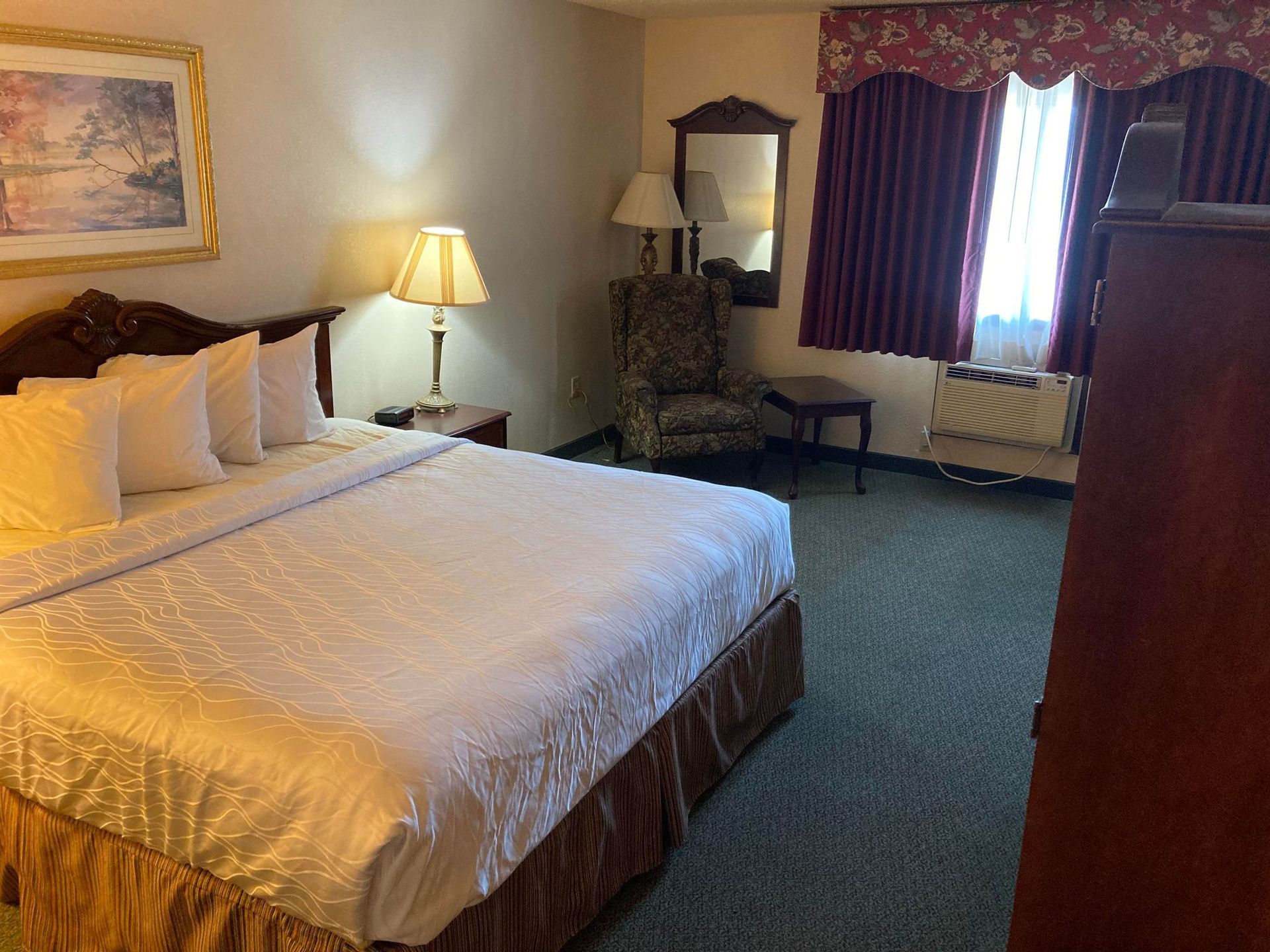 King bed room with large windows, full amenities, and space for long-term travelers in Southern Iowa.