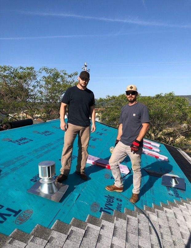 boys working on the roof