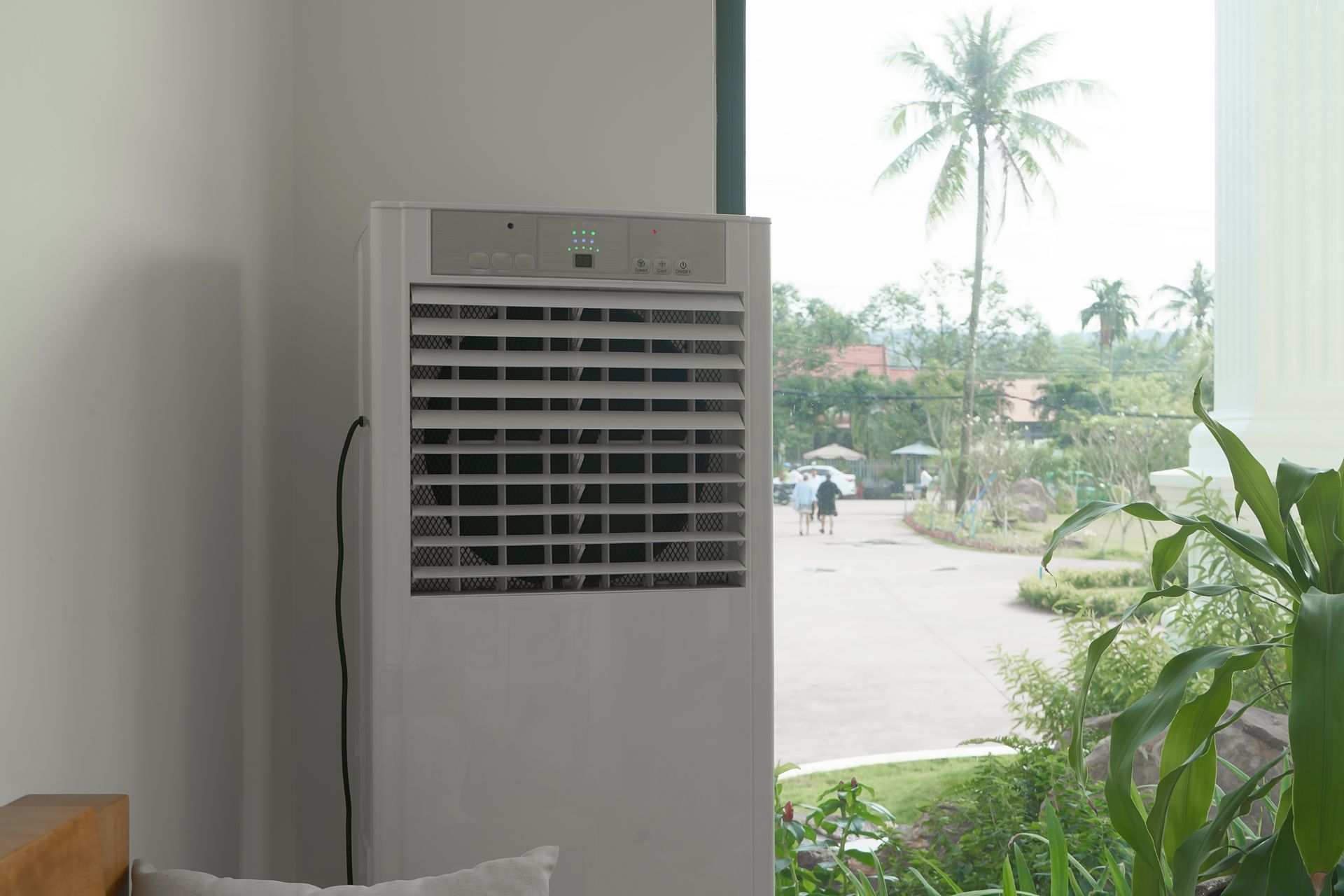 A Large Air Conditioner Is Sitting In A Room Next To A Window