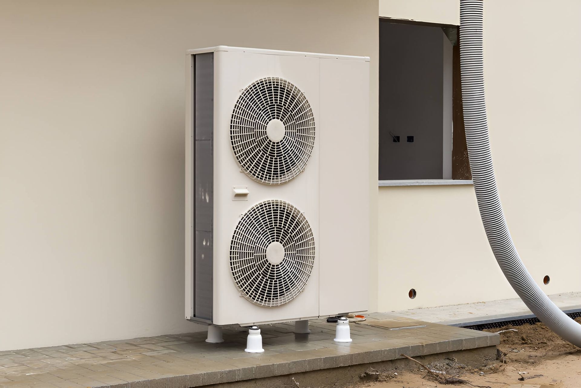 A Large Air Conditioner is Sitting on the Side of a Building — DMC Electrical & Air Cooling Pty Ltd in Townsville City, QLD