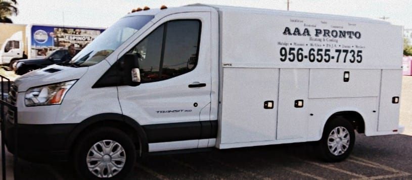 A white aaa pronto van is parked in a parking lot