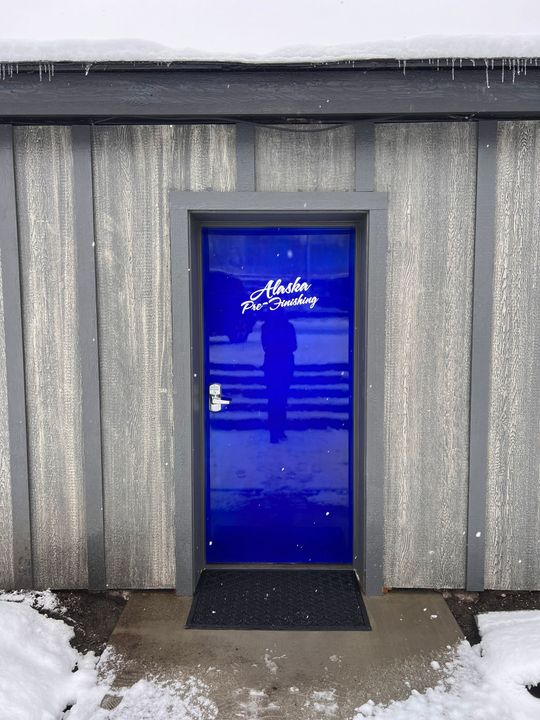 A blue door with the word nicole written on it