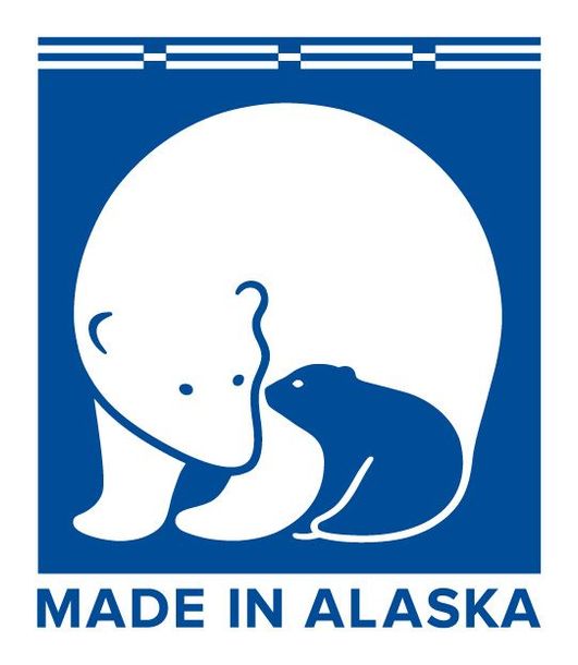 A made in alaska logo with a polar bear and frog