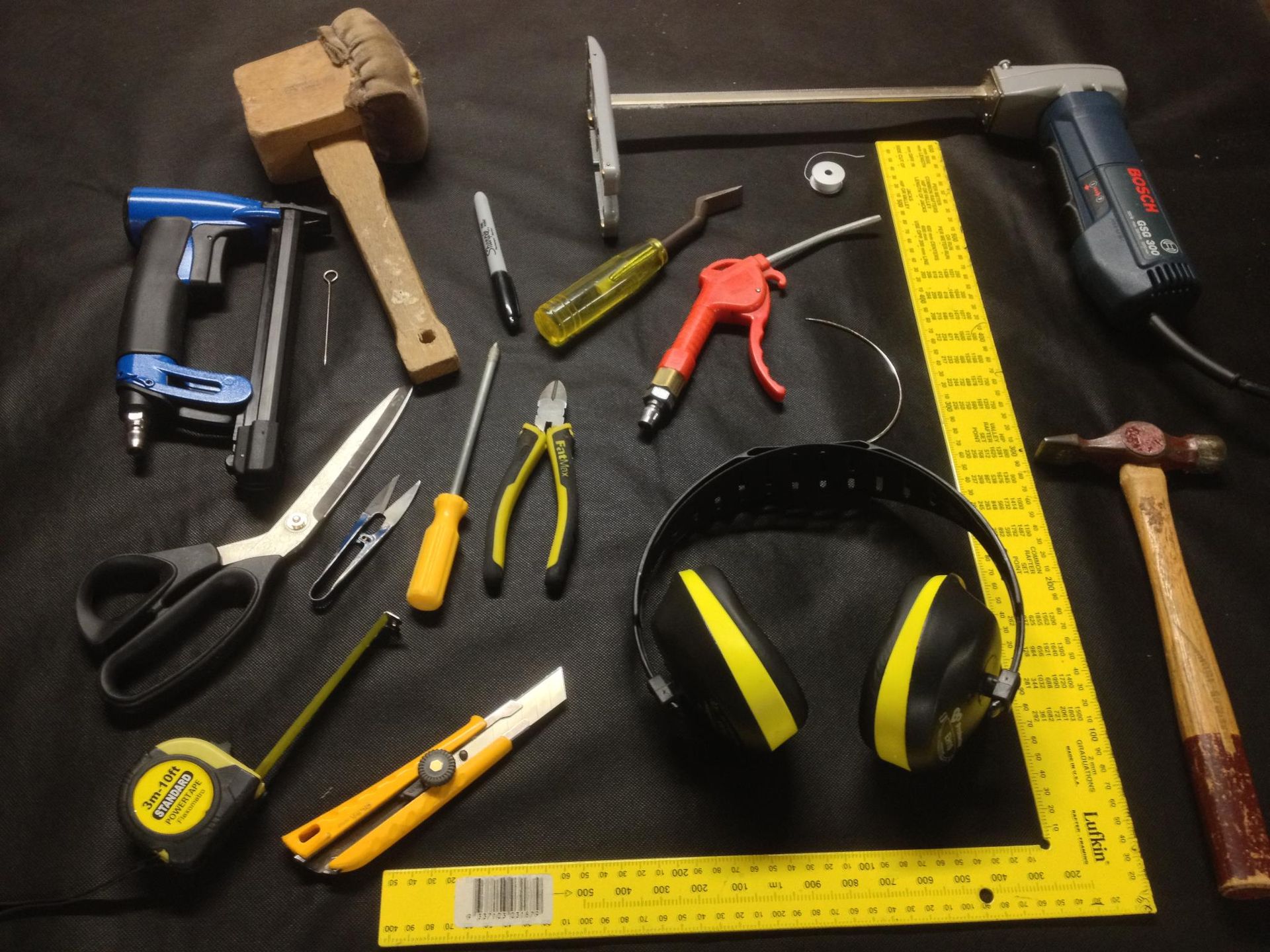 A Bunch of Tools on A Table Including a Bosch Drill — Metreson Upholstery In Unanderra, NSW