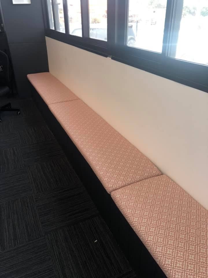 A Long Bench with Pink Cushions in Front of A Window — Metreson Upholstery In Unanderra, NSW