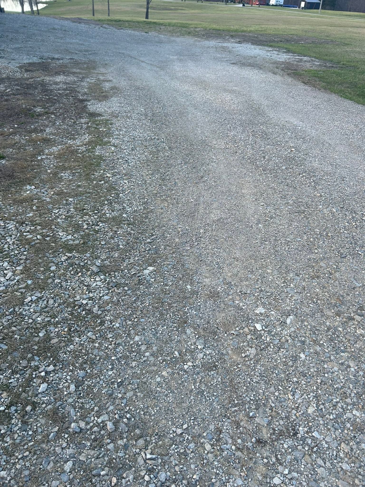 Gravel path curving through a grassy area outdoors