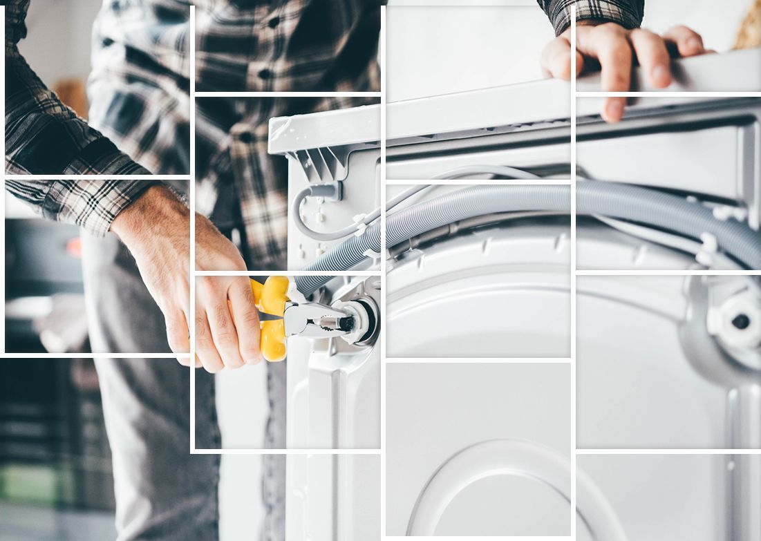 A man is fixing a washing machine with a screwdriver. A man is fixing a washing machine with a screwdriver.