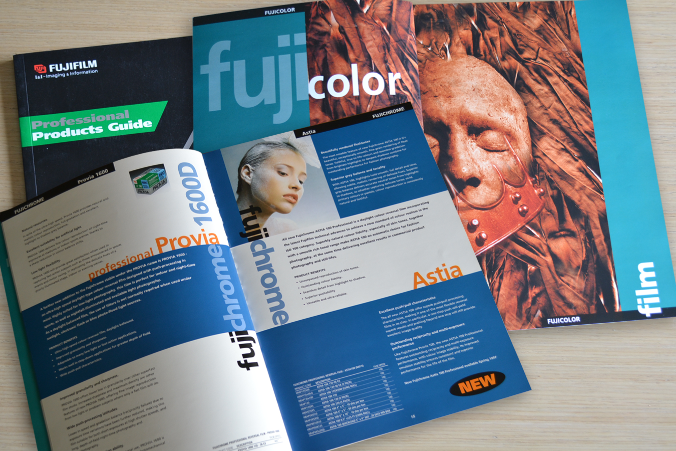 A fuji color brochure is open on a table