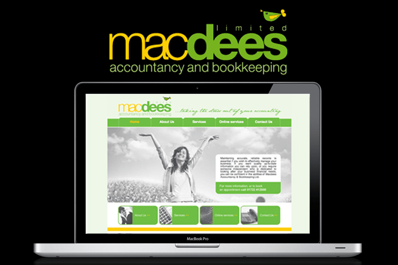 A laptop is open to a macdees accountancy and bookkeeping website