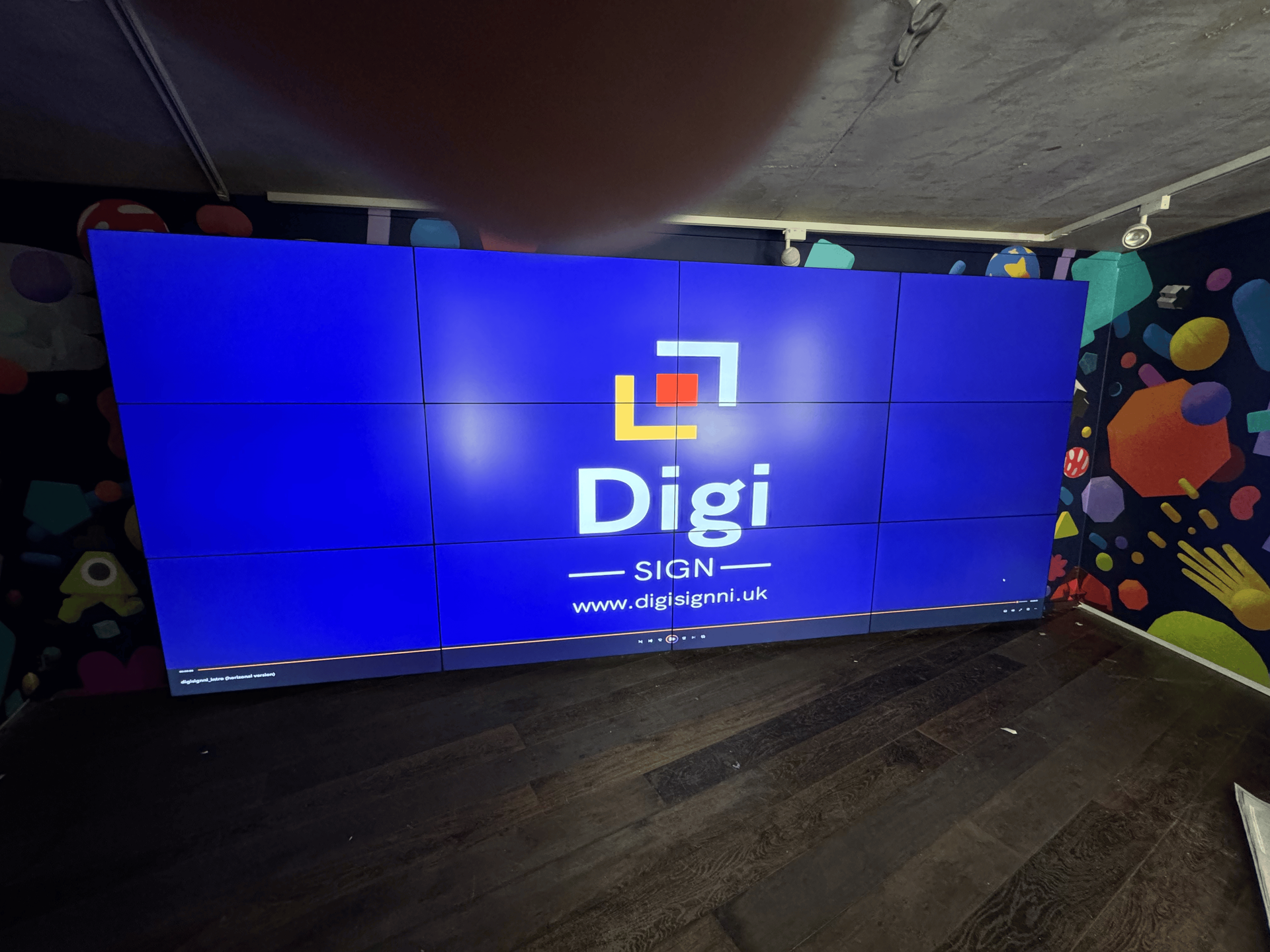 A large screen with the word digi on it