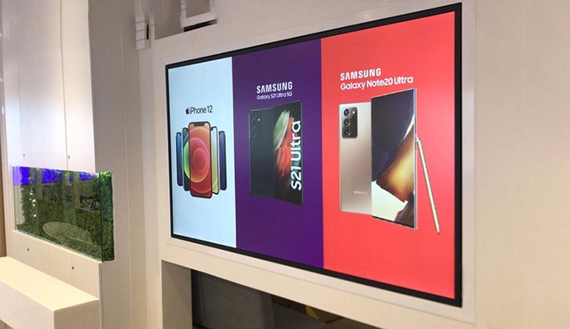 A flat screen tv with a picture of a shoe on it.