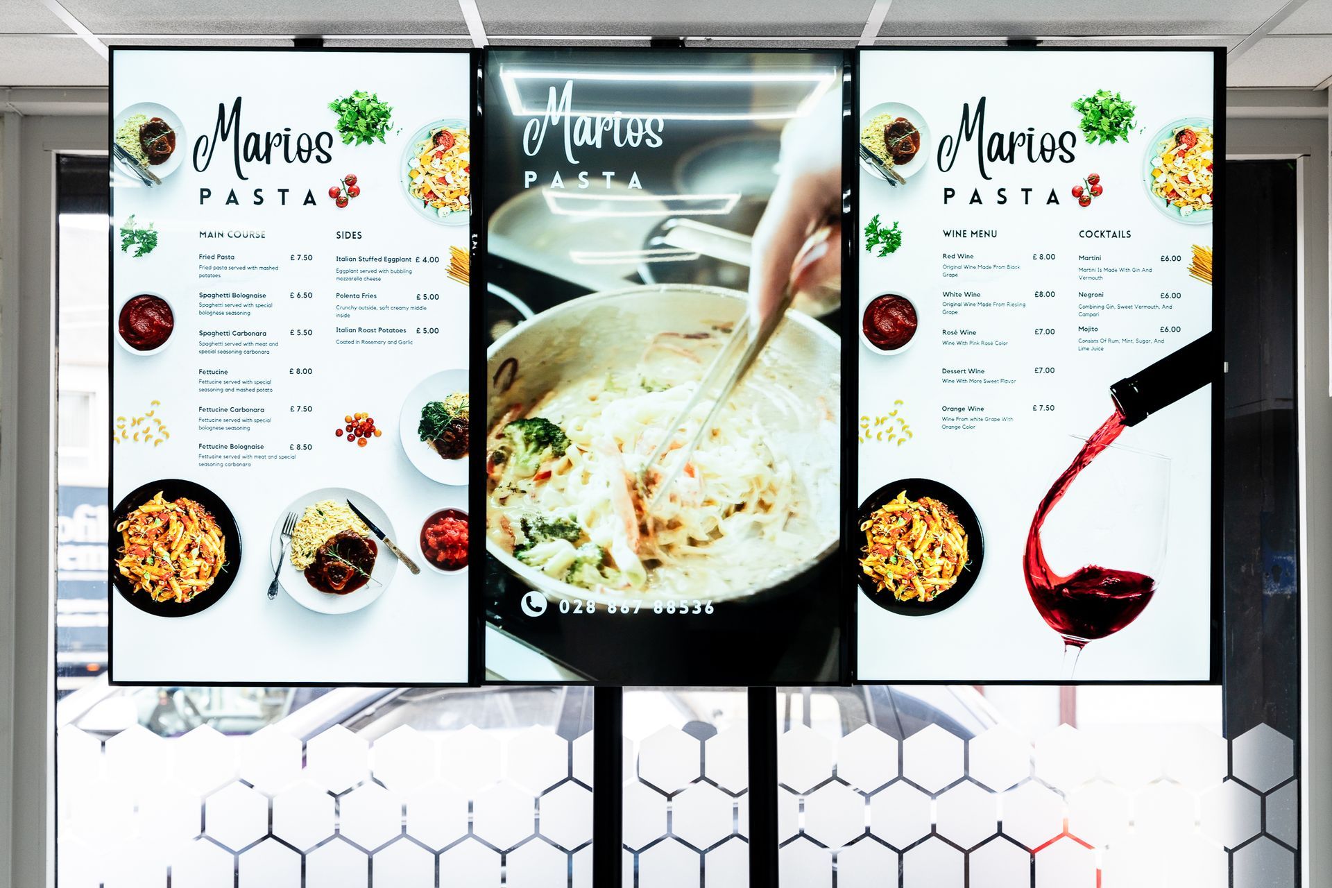 A large screen displays a menu for a restaurant.