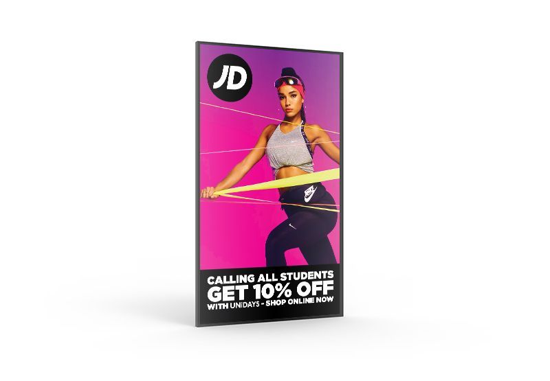 A poster for jd sports with a woman holding a hula hoop.