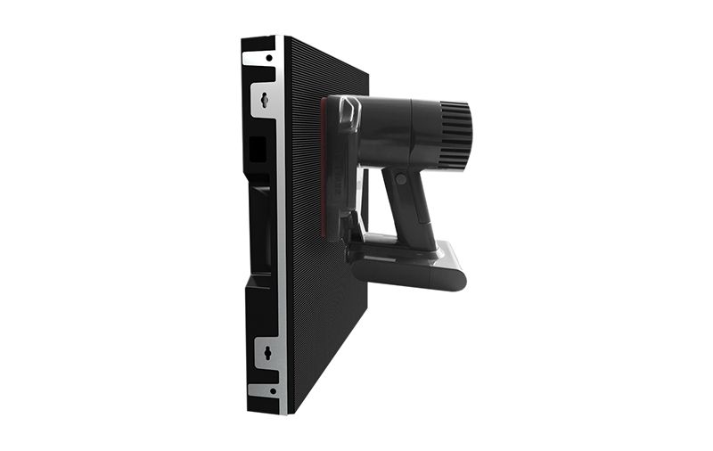 A computer monitor with a vacuum cleaner attached to it on a white background.