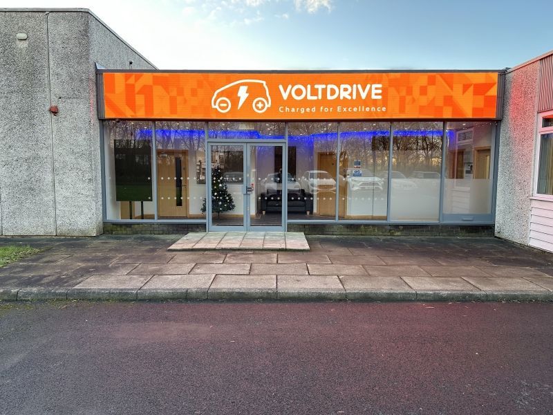 A building with a sign that says voltdrive on it