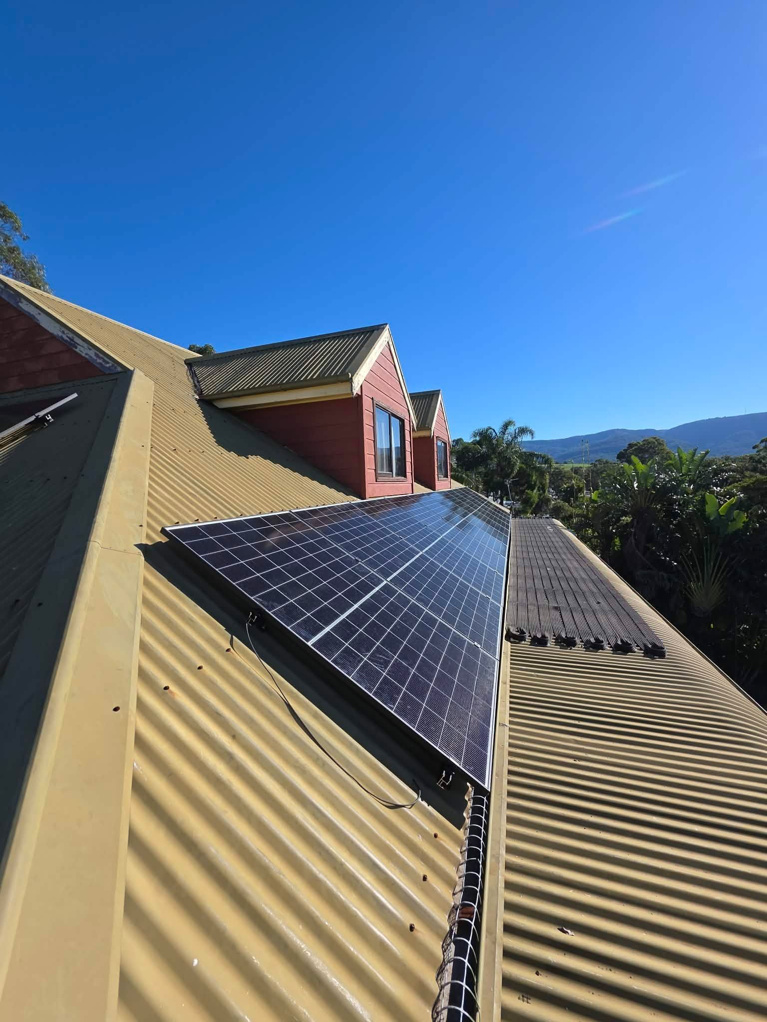 Roof With Solar Panels and Corrugated Metal Siding — Rapidcool Air Conditioning, Electrical & Solar In Albion Park, NSW