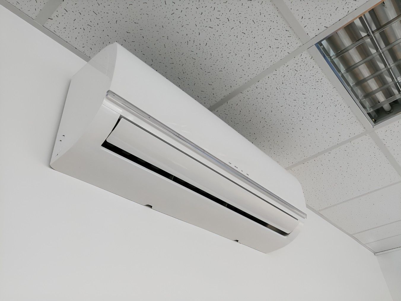 Split system air conditioner installed on a commercial wall in Wollongong