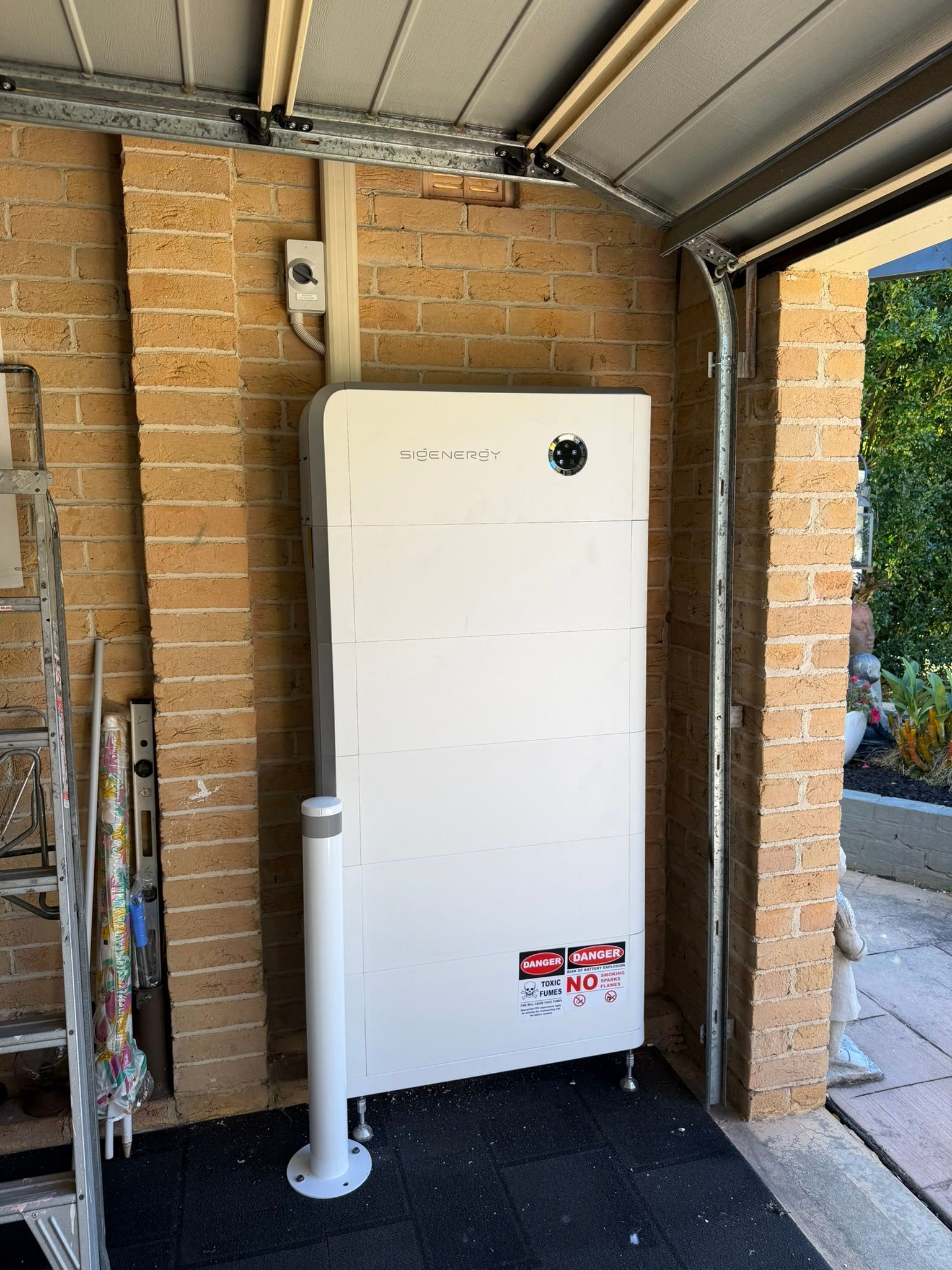 White Utility Cabinet in a Brick Garage — Rapidcool Air Conditioning & Electrical In Dapto, NSW