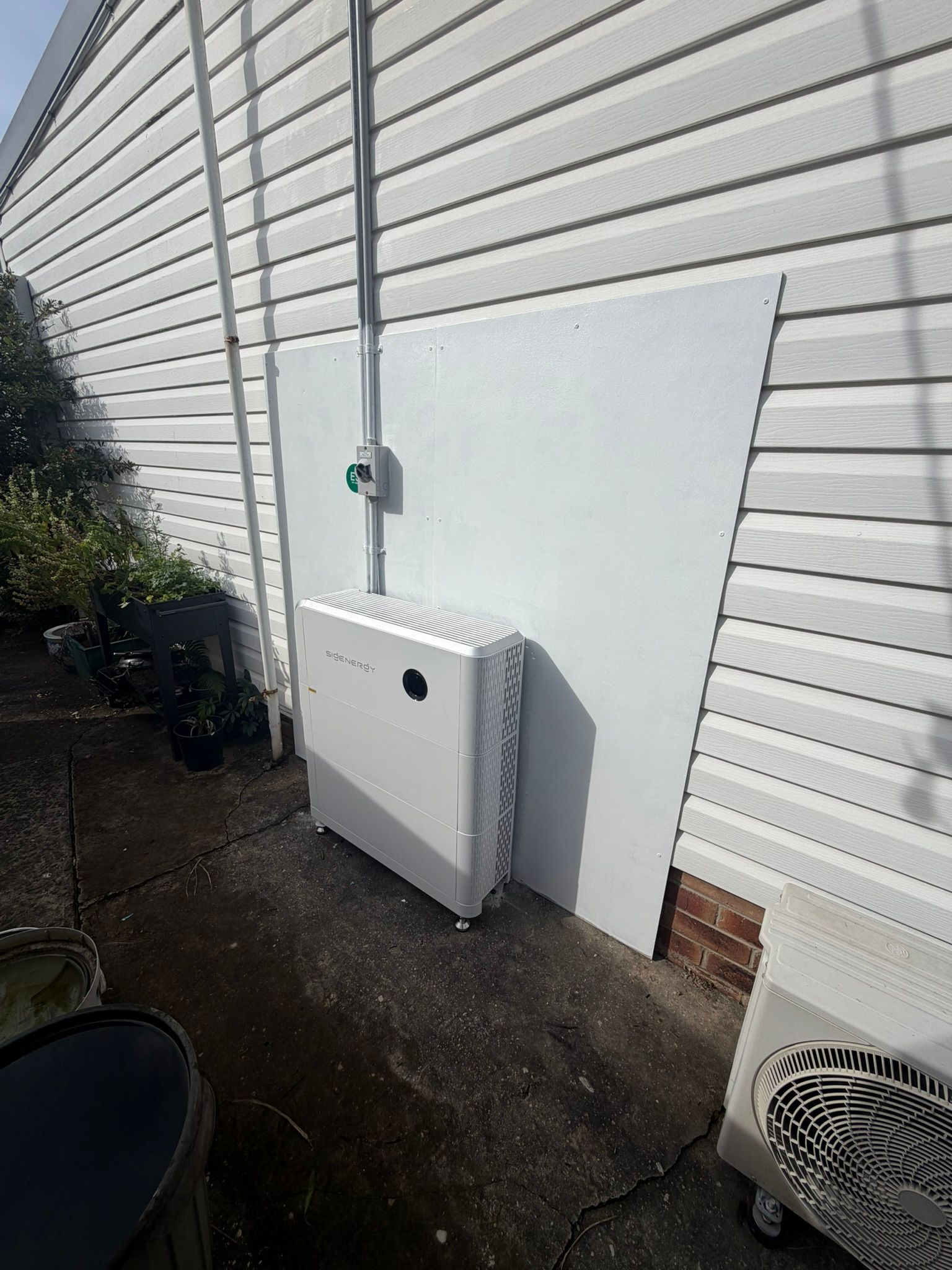 Exterior Wall With Mounted White Utility Box — Rapidcool Air Conditioning, Electrical & Solar In Woonoona, NSW