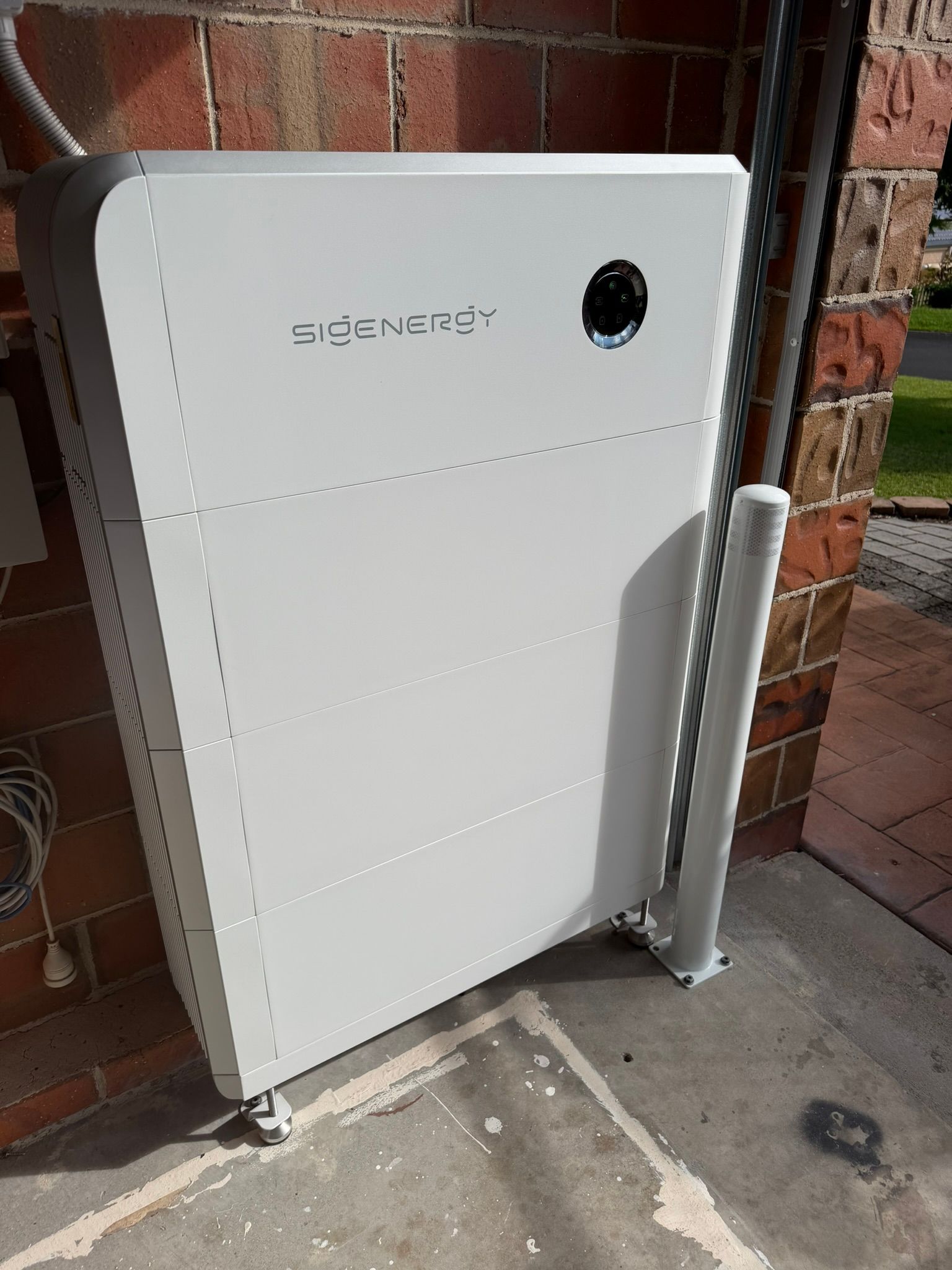 White Utility Cabinet Against a Brick Wall — Rapidcool Air Conditioning, Electrical & Solar In Woonoona, NSW