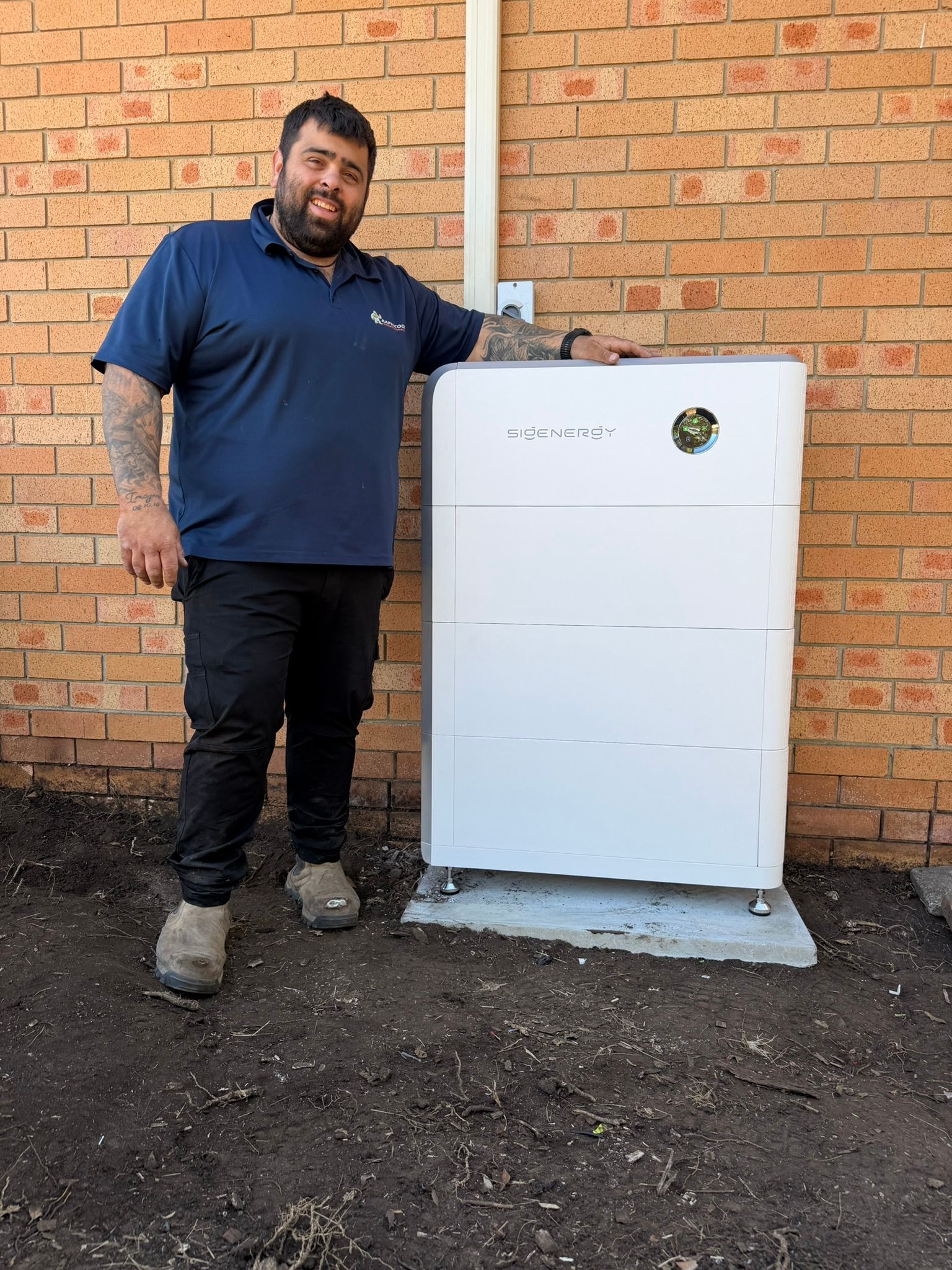 Man Standing Beside a White Appliance — Rapidcool Air Conditioning & Electrical In Dapto, NSW