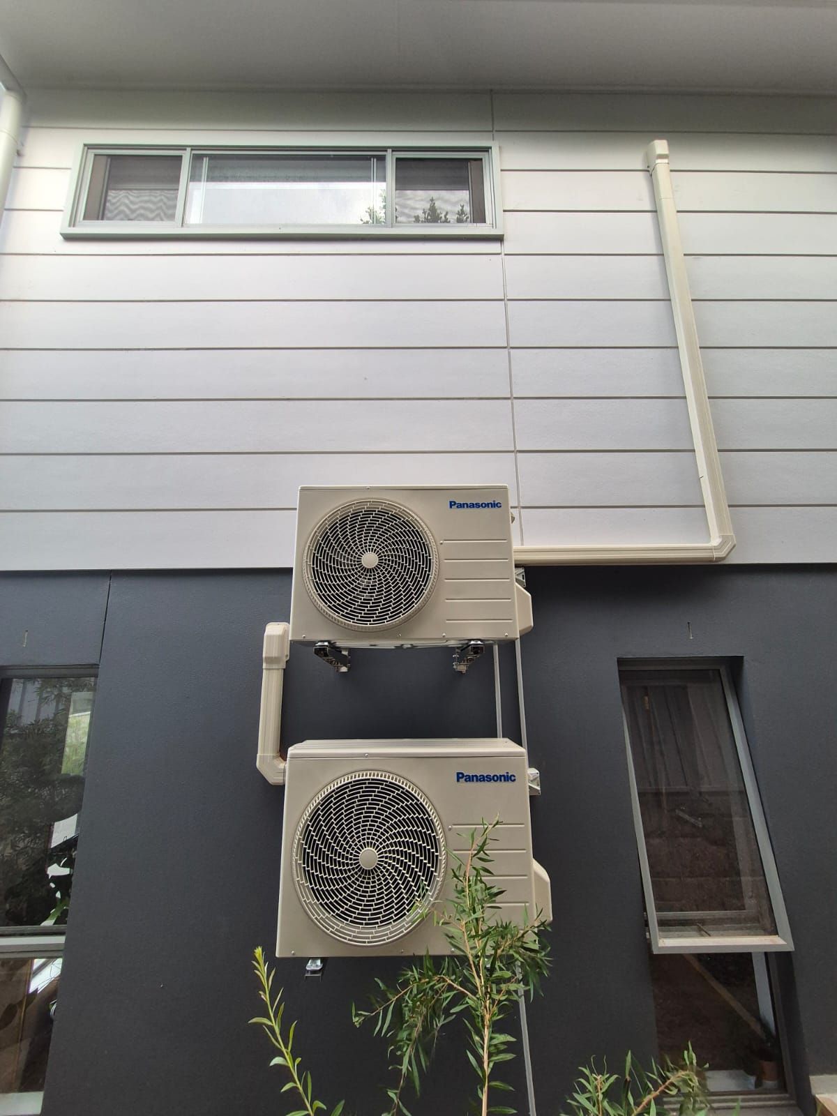 A Room With A Lot Of Windows And An Air Conditioner — Rapidcool Air Conditioning, Electrical & Solar In Dapto, NSW