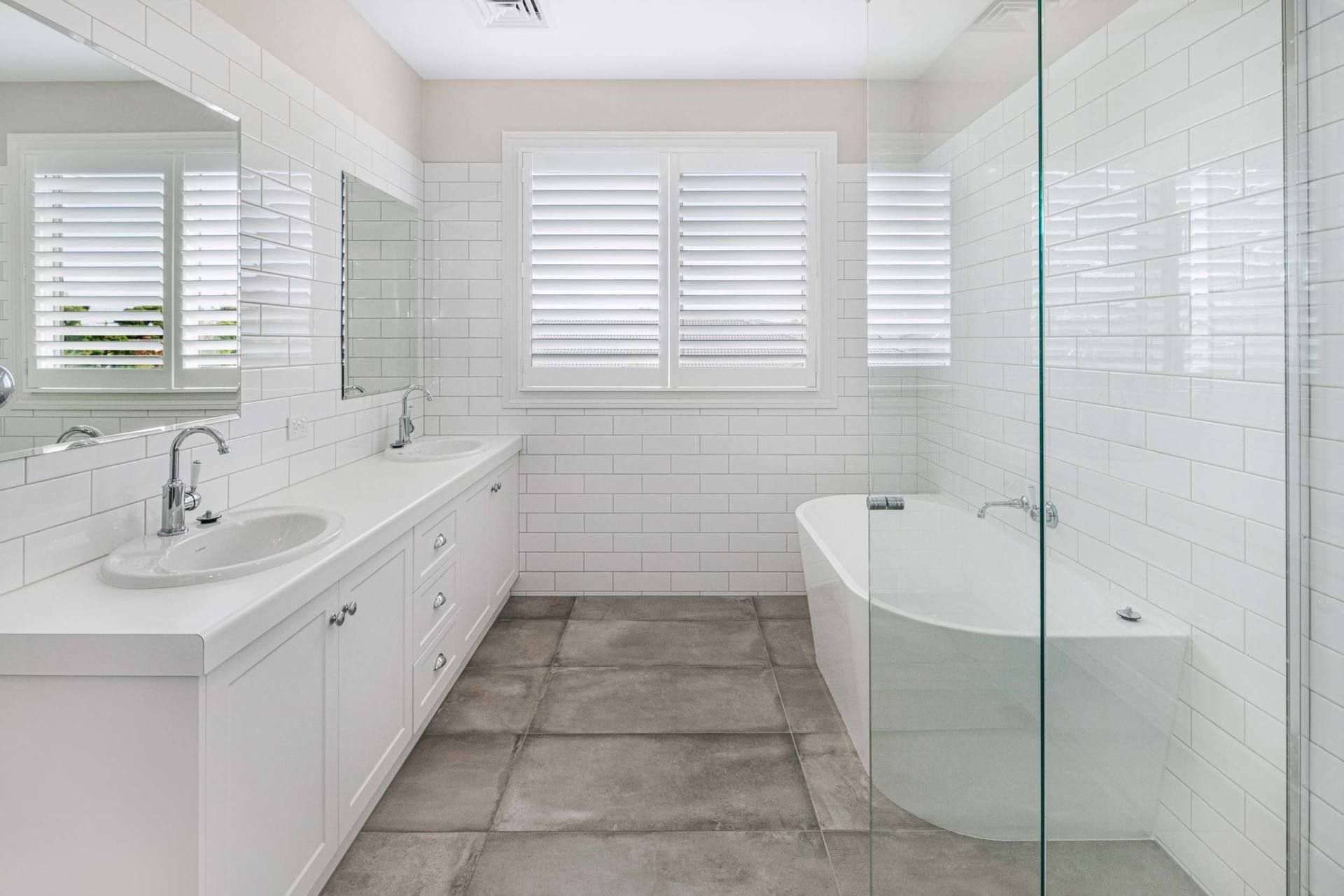 White Classic Bathroom Window With Plantation Shutters — Ballarat Blinds & Curtains In Wendouree, VIC