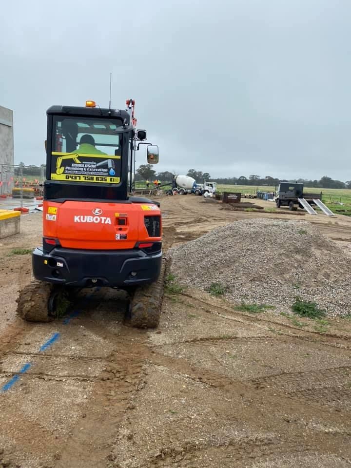 Orange Kubota Excavator on a Construction Site — Donaldson Plumbing & Excavations in Wodonga, VIC