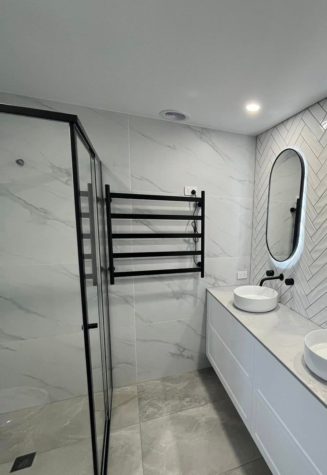 Modern Bathroom With White Marble Tile Walls — Donaldson Plumbing & Excavations in Baranduda, VIC