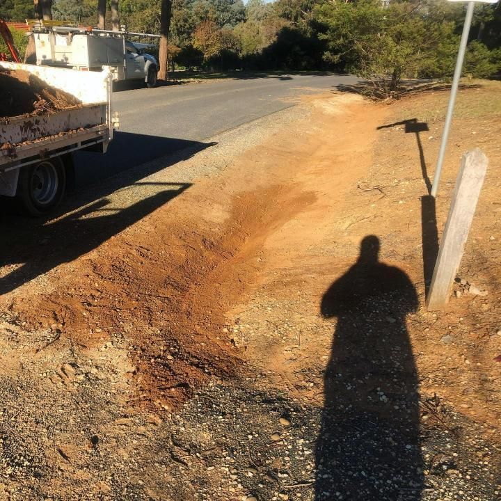 Shadow of a Person on a Dirt Path Next to a Road — Donaldson Plumbing & Excavations in Chiltern, VIC