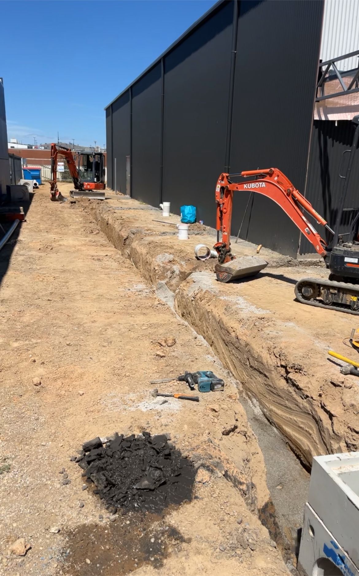 Construction Site With Excavators Digging a Trench — Donaldson Plumbing & Excavations in Baranduda, VIC