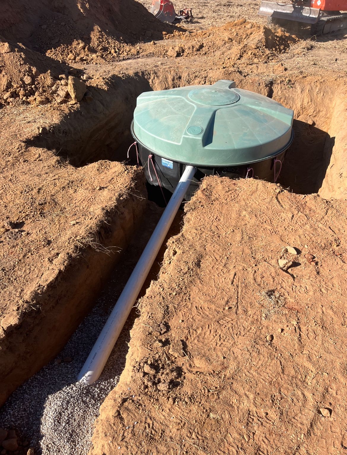 Green Septic Tank Lid With White Pipe — Donaldson Plumbing & Excavations in Baranduda, VIC