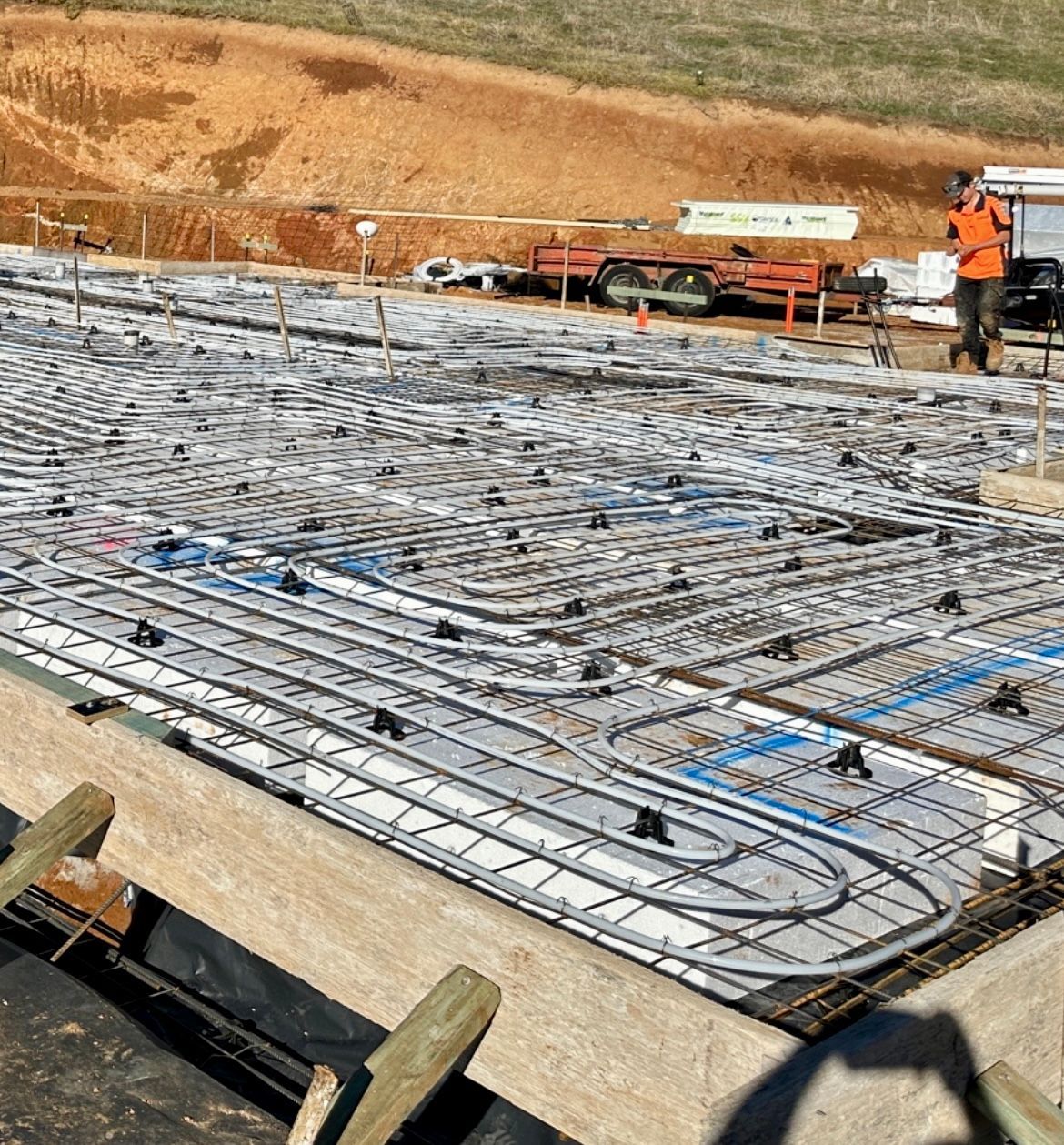 Construction Site With Heating Tubes Laid Over Wire Mesh — Donaldson Plumbing & Excavations in Baranduda, VIC