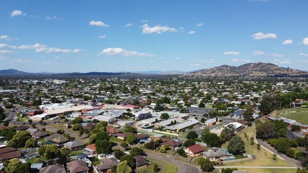 Aerial View of a Residential Area With a Mountain — Donaldson Plumbing & Excavations in Wodonga, VIC