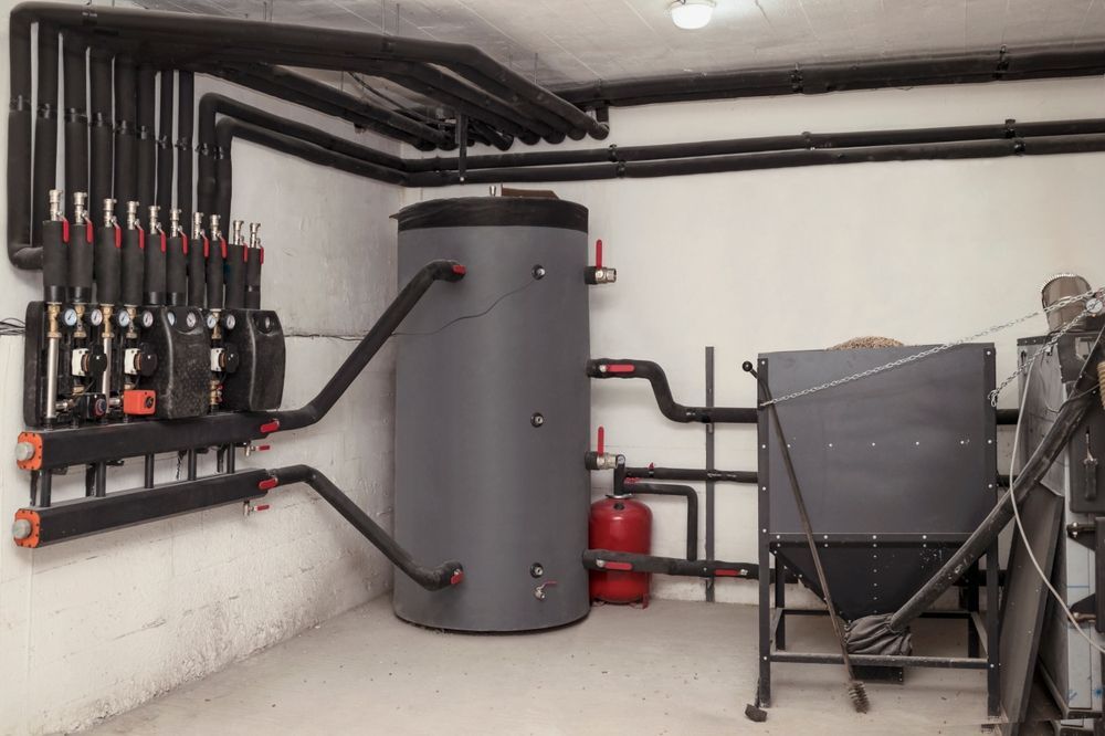 Heating System With Pipes, Water Tank, and Boiler — Donaldson Plumbing & Excavations in Chiltern, VIC