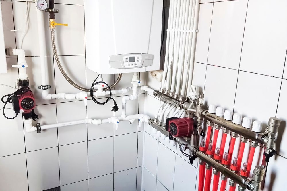 White-Tiled Utility Room With a Gas Boiler — Donaldson Plumbing & Excavations in Chiltern, VIC