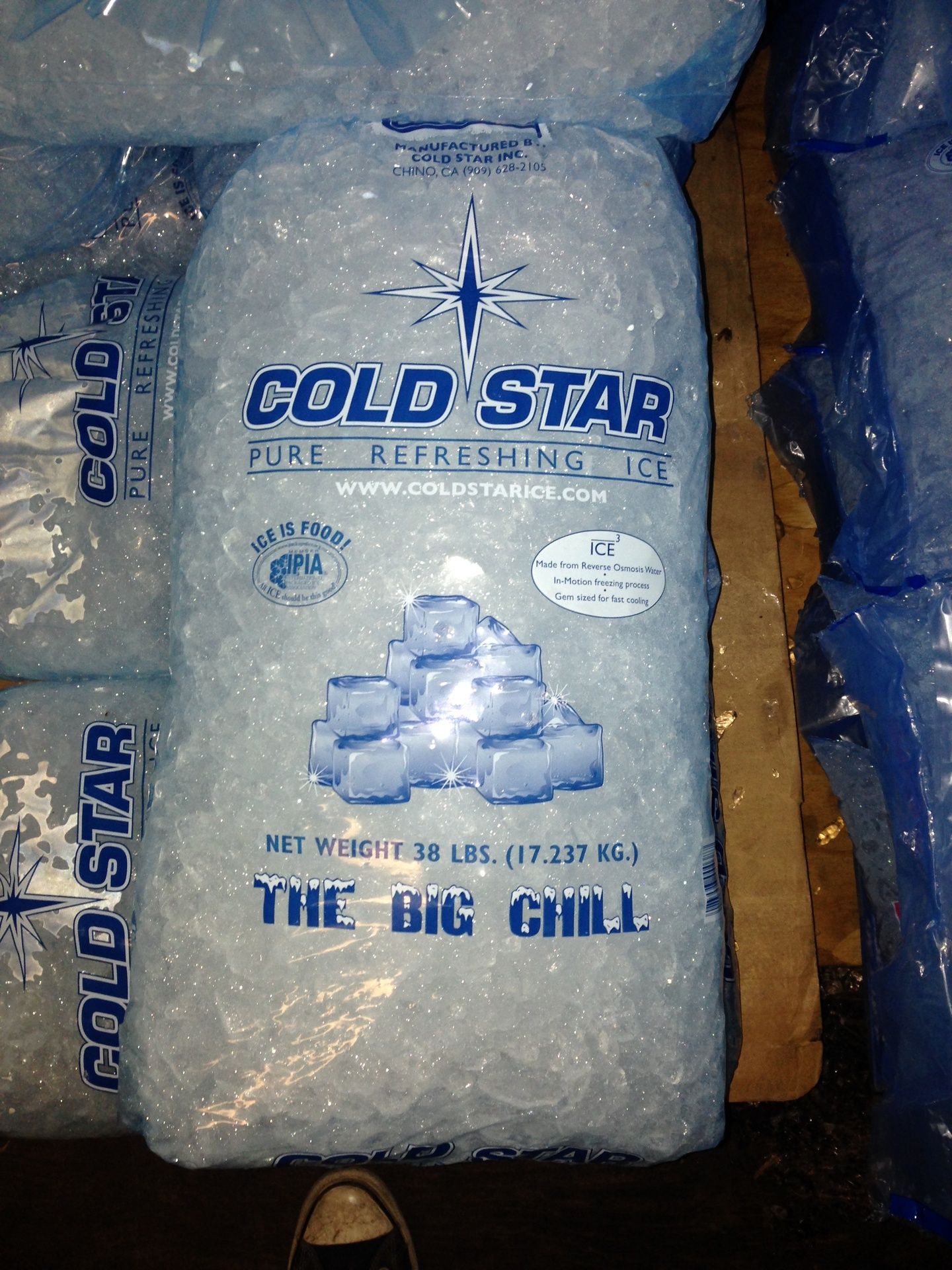 A bag of cold star ice sits on a wooden pallet