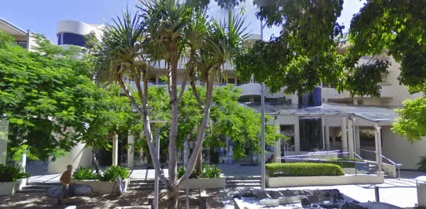 A Large Building With a Lot of Trees in Front of It — FlowWise in Maroochydore, QLD