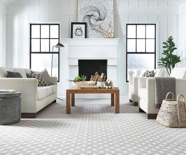 A living room filled with furniture and a fireplace.
