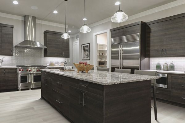 A kitchen with stainless steel appliances and granite counter tops