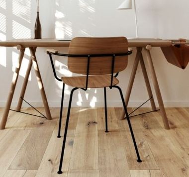 A wooden chair sits in front of a wooden desk