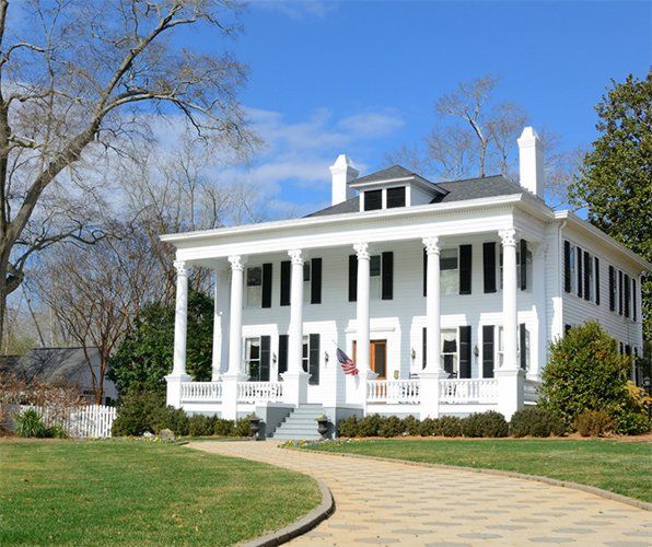 Historic White House with American Flag — Gainesville, FL — Gainesville Pest Control LLC Historic White House with American Flag — Gainesville, FL — Gainesville Pest Control LLC