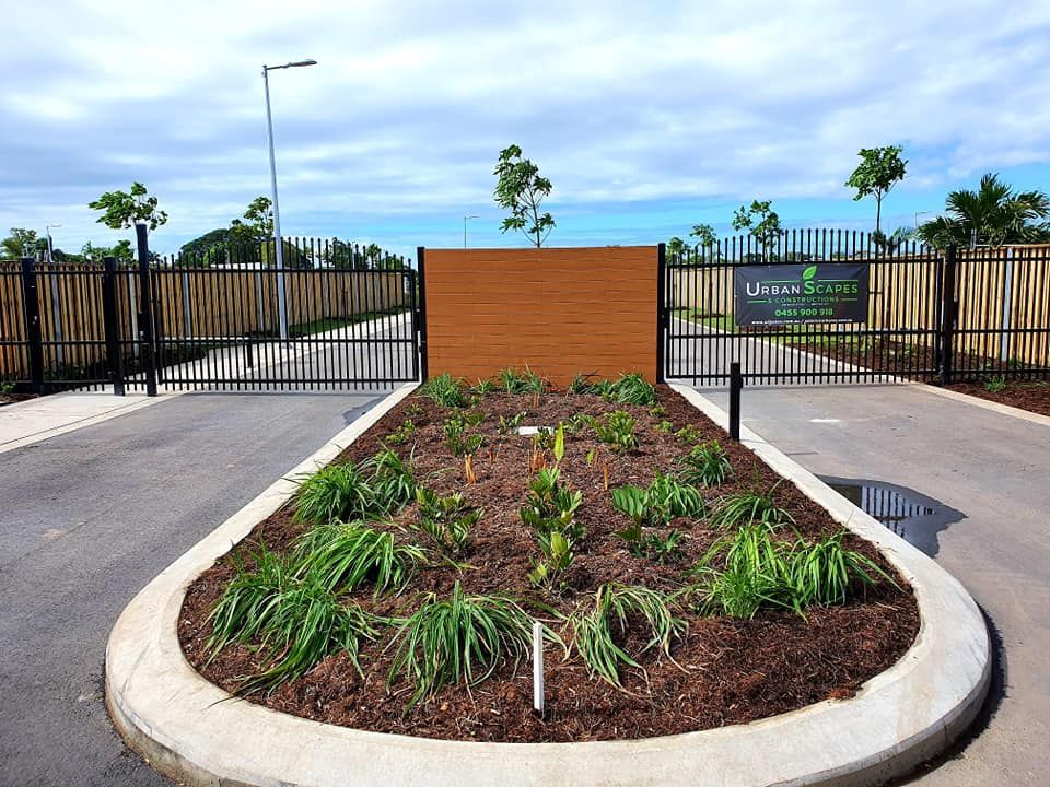An Entrance to a Gated Community Featuring a Central Landscaped Island — Gate-O-Matic in Garbutt, QLD