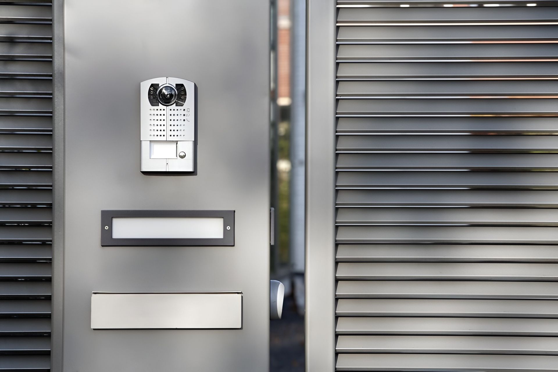 A Modern Grey Metal Gate With a Keypad Entry System — Gate-O-Matic in Garbutt, QLD