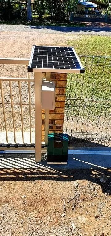 Solar Panel and Gate Opener Mounted on a Brick Pillar, Part of a Metal Gate — Gate-O-Matic in Garbutt, QLD