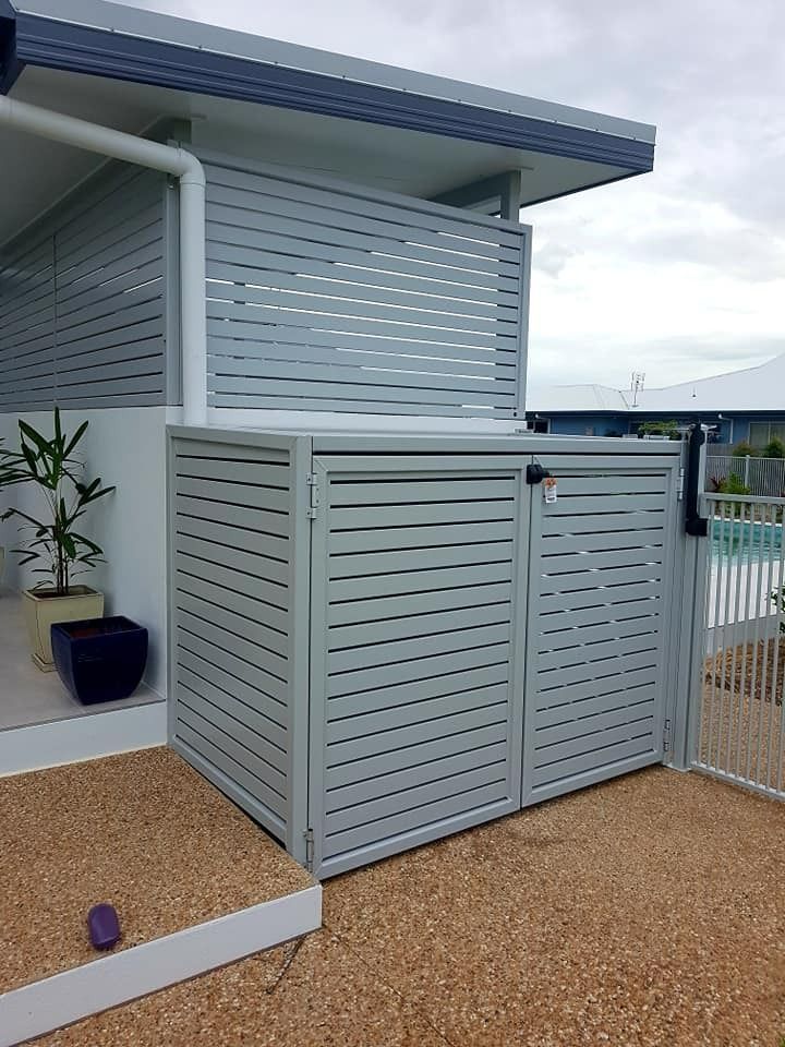 A Light Grey, Slatted Metal Enclosure Hides Bins — Gate-O-Matic in Garbutt, QLD