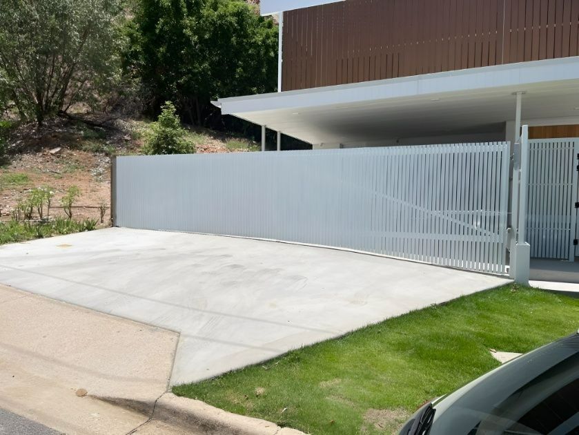 White Slatted Gate and Driveway in Front of a Modern Home — Gate-O-Matic in Garbutt, QLD